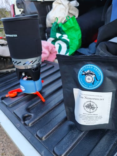 Grounded Drops Nemophilist pouch and a camp stove on a ute tray